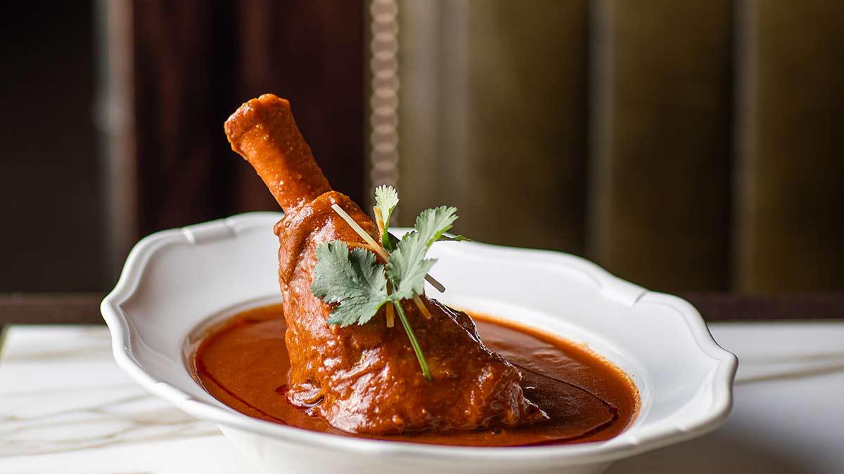 Gymkhana signature dishes Pork Cheek VindalooChicken Butter MasalaTandoori Masala Lamb Chops